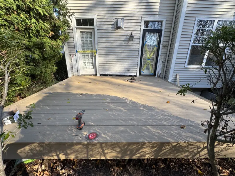 New deck under construction with boards being laid