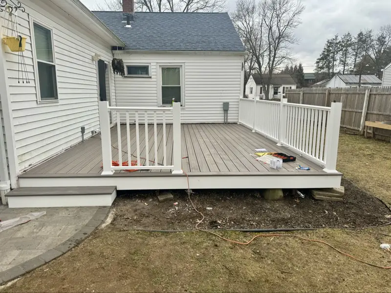 Restored composite deck with white railings